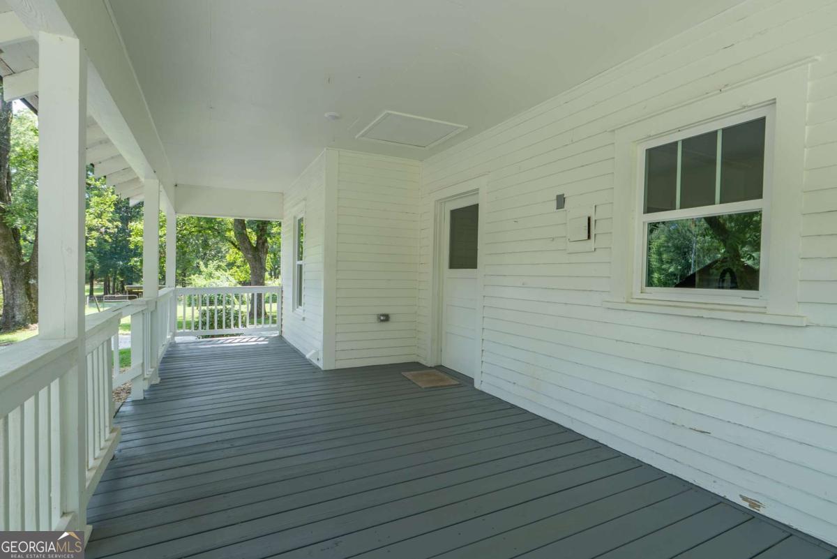 5380 Guthrie Road Loganville, GA 30052 - Photo 26 of 38 a view of a house with wooden deck