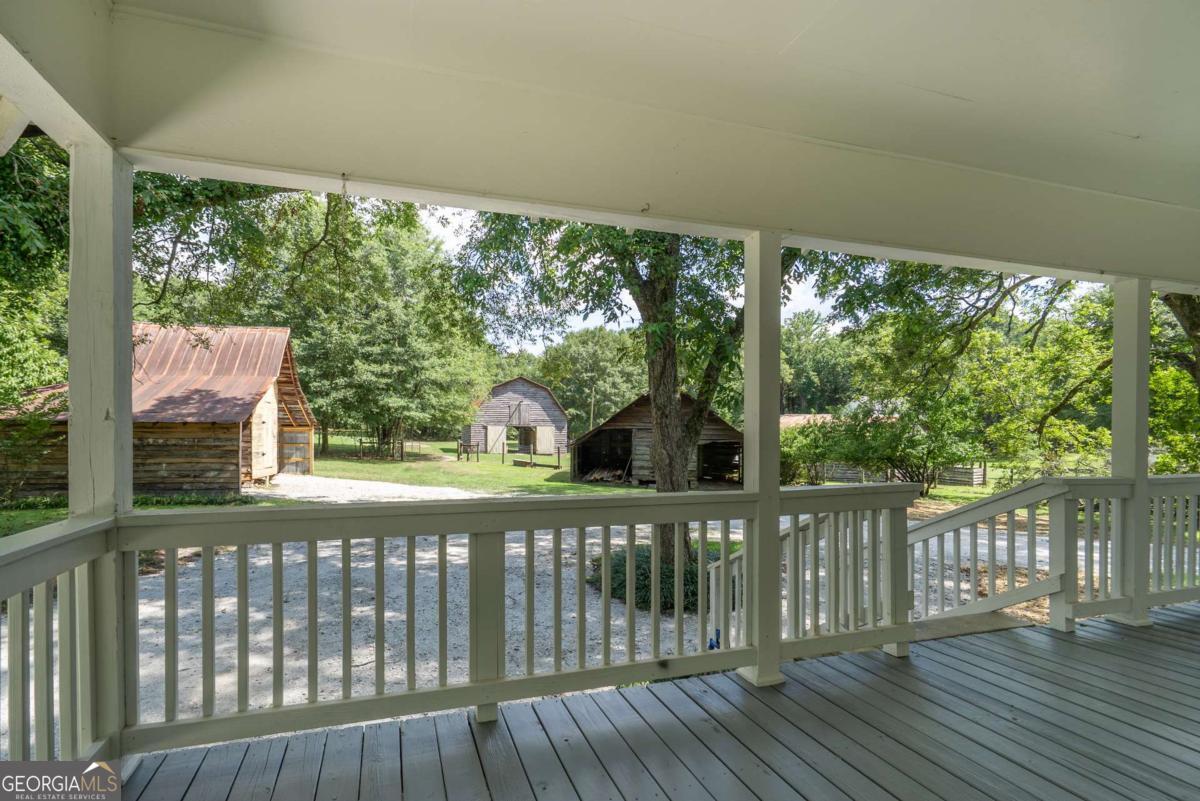 5380 Guthrie Road Loganville, GA 30052 - Photo 27 of 38 a view of a wooden deck