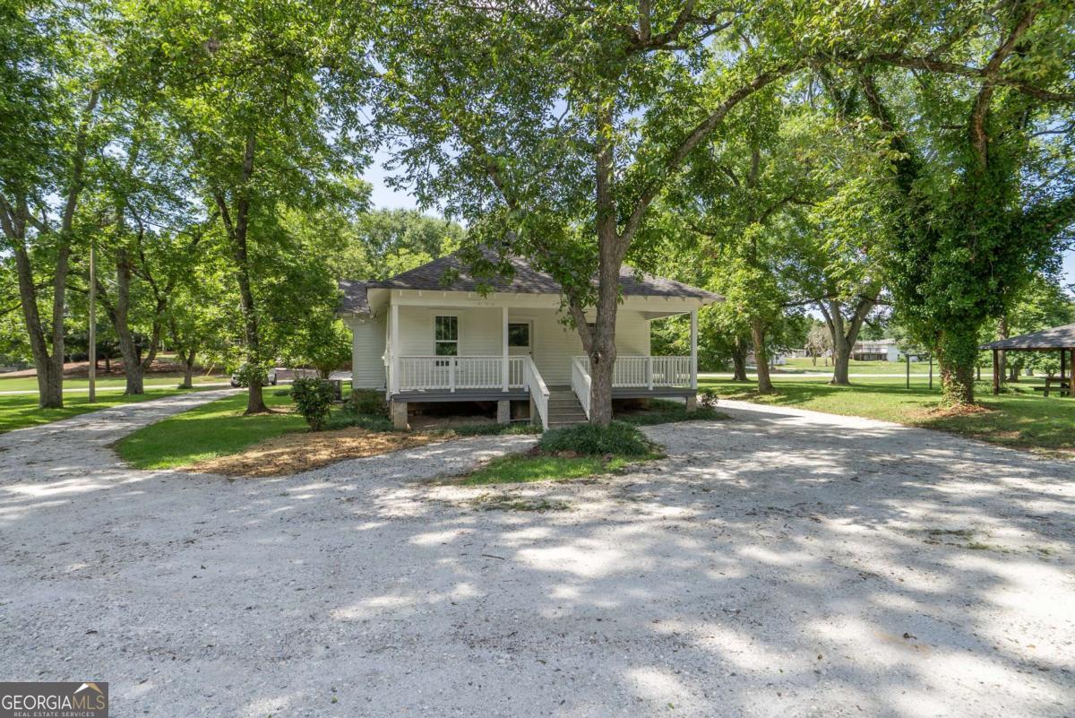 5380 Guthrie Road Loganville, GA 30052 - Photo 28 of 38 a view of a house with a yard