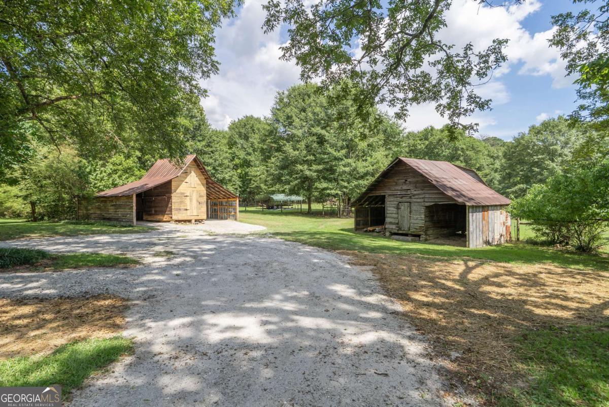 5380 Guthrie Road Loganville, GA 30052 - Photo 3 of 38 a front view of house with yard and green space