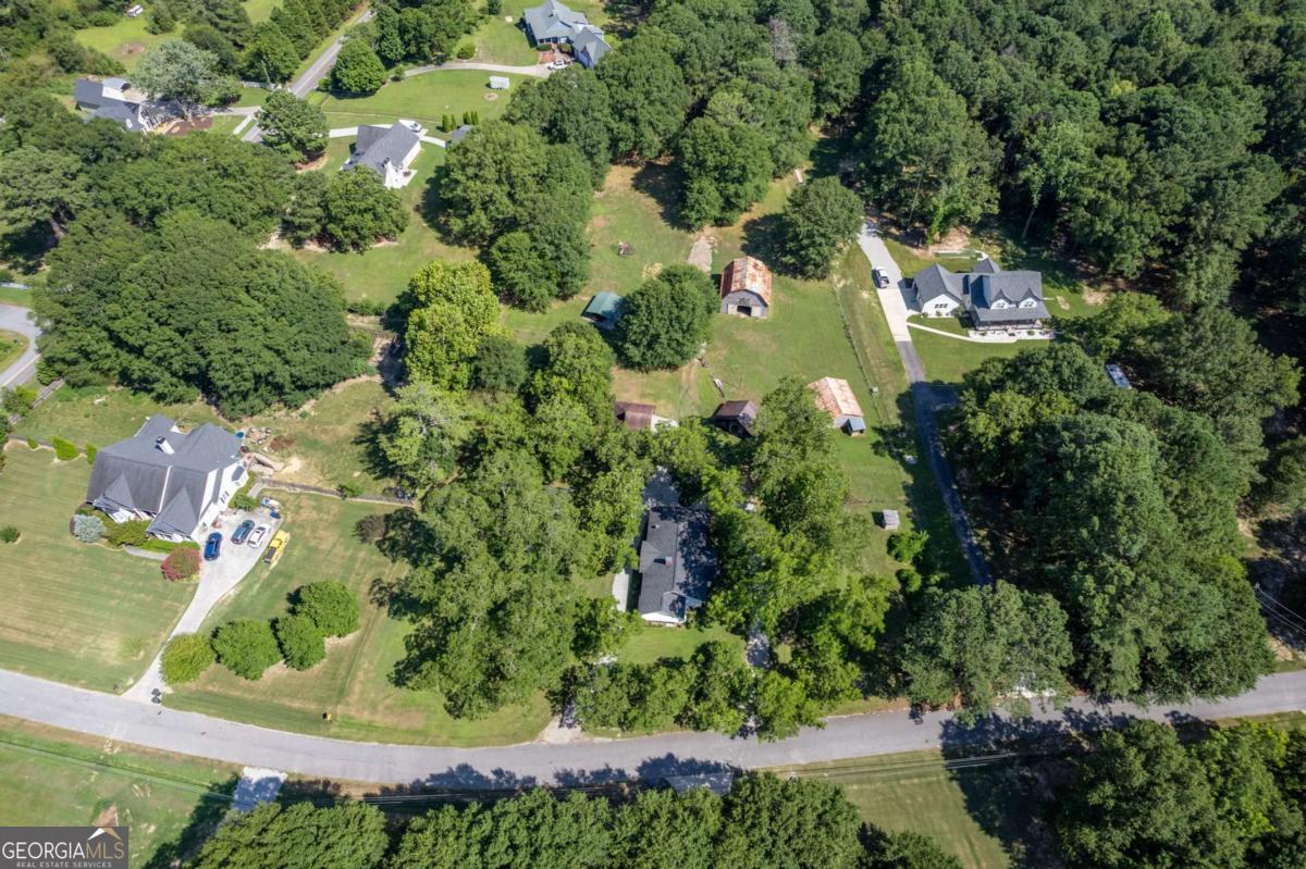 5380 Guthrie Road Loganville, GA 30052 - Photo 38 of 38 an aerial view of residential house with outdoor space and trees all around