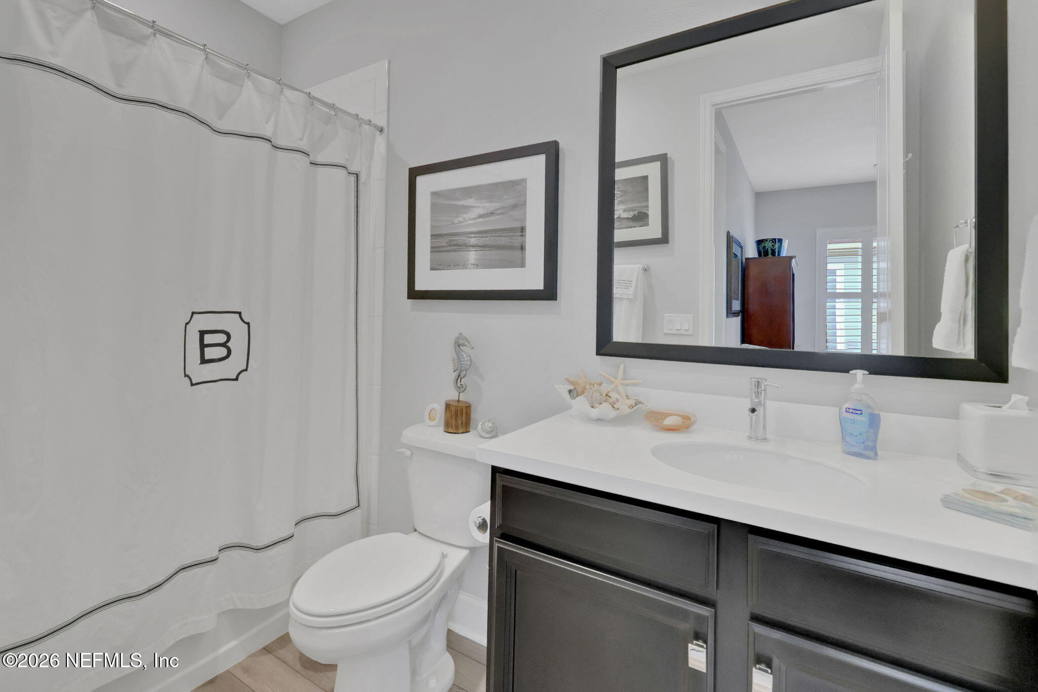 146 Clarendon Road St. Johns, FL 32259 - Photo 33 of 59 a bathroom with a toilet sink and mirror