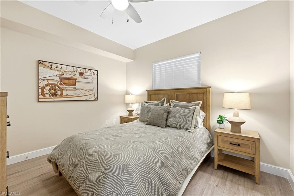 401 Bayfront Place, Unit 3307 Naples, FL 34102 - Photo 17 of 28 Bedroom featuring light wood-type flooring and ceiling fan