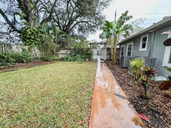 a backyard of a house with lots of green space