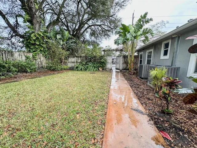 a backyard of a house with lots of green space