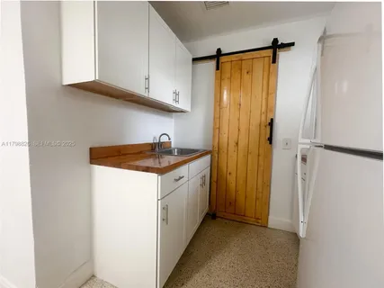 a utility room with cabinets