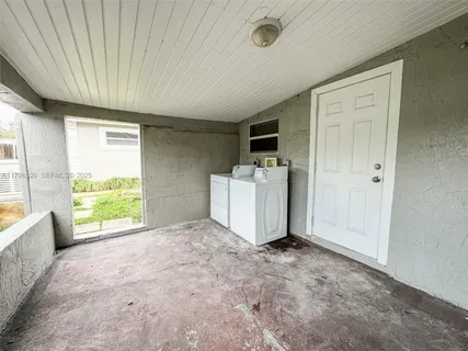 a view of an empty room with a window