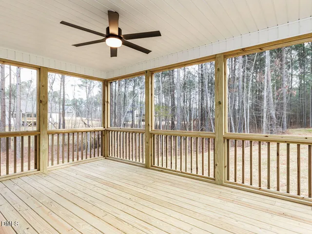 a view of a balcony with wooden floor