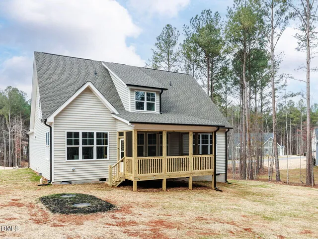 a house with trees in the background