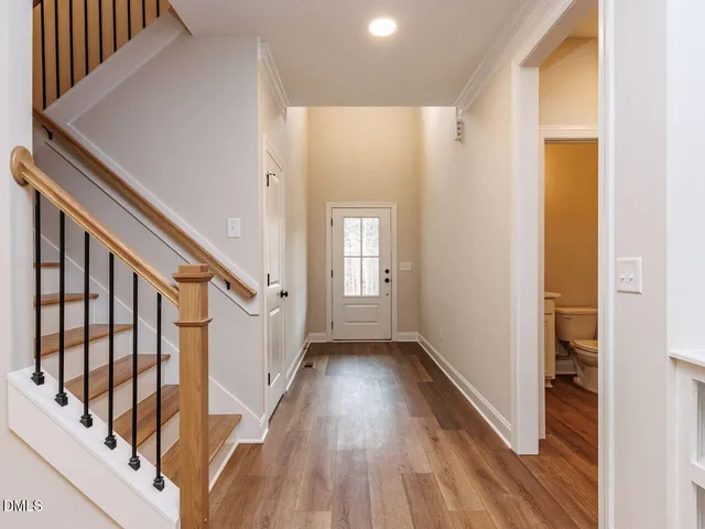 a view of an entryway with wooden floor