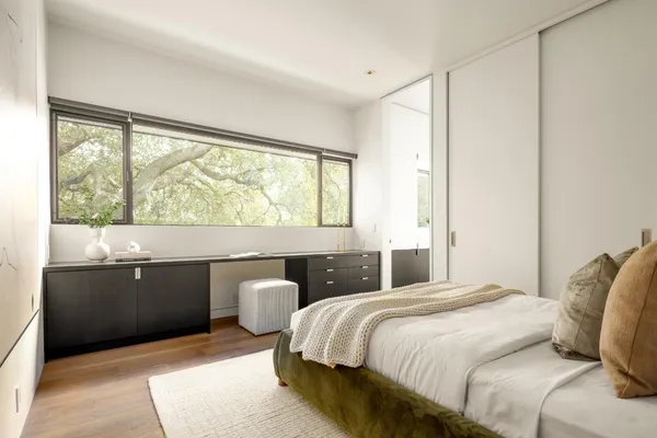 a bedroom with a bed and window