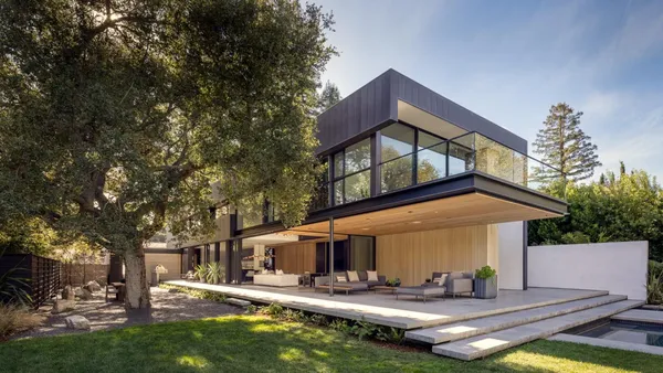 a front view of house with yard outdoor seating and yard