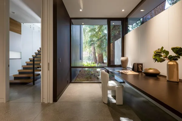 a lobby with furniture and floor to ceiling window