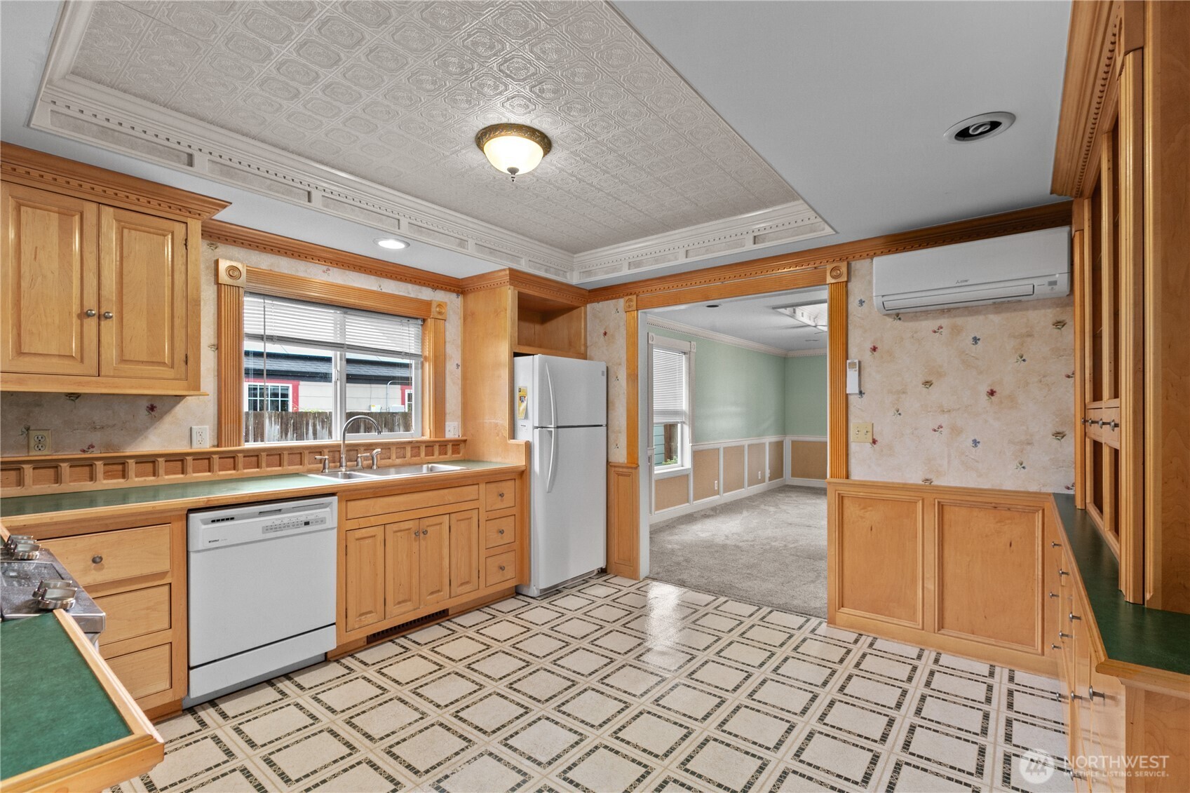 1108 18th Street Anacortes, WA 98221 - Photo 11 of 37 a kitchen with stainless steel appliances granite countertop a refrigerator and a stove top oven