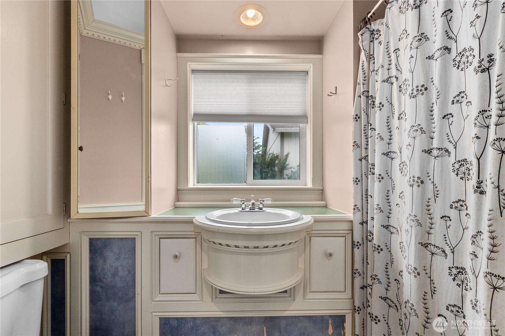 1108 18th Street Anacortes, WA 98221 - Photo 15 of 37 a bathroom with a sink and a mirror