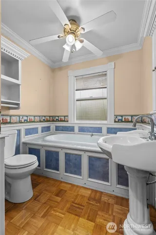 a bedroom with a bed and a sink