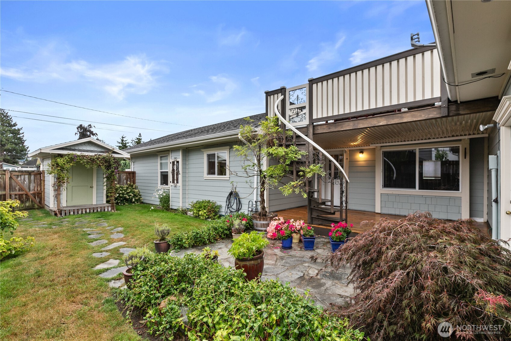 1108 18th Street Anacortes, WA 98221 - Photo 25 of 37 a front view of a house with garden
