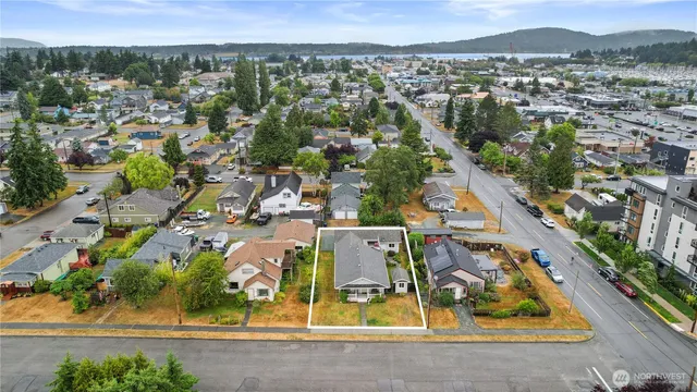 an aerial view of residential houses with outdoor space