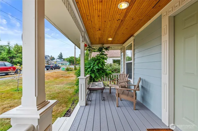 a view of balcony with chair and wooden floor