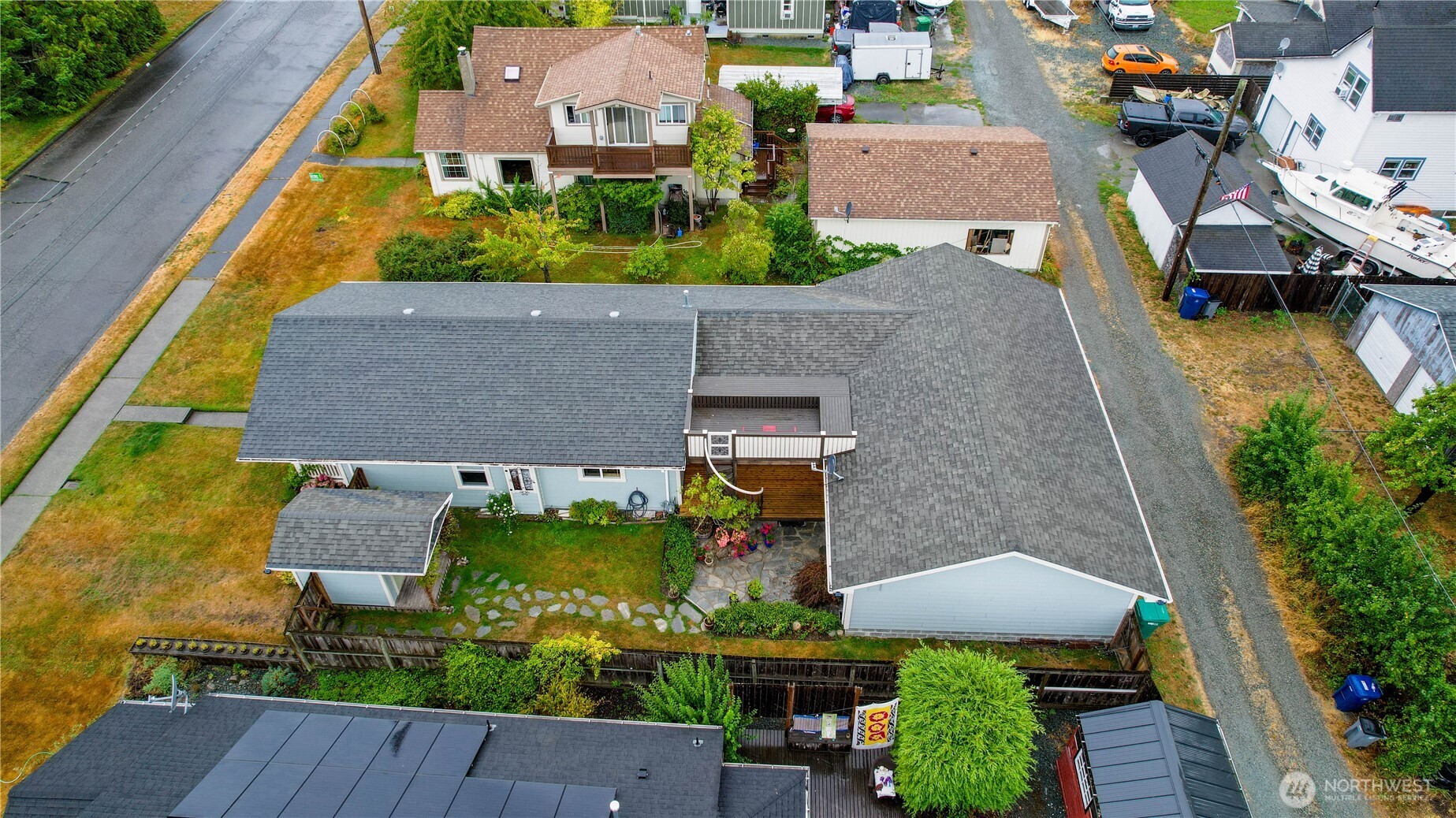 1108 18th Street Anacortes, WA 98221 - Photo 36 of 37 an aerial view of a house with a garden and lake view