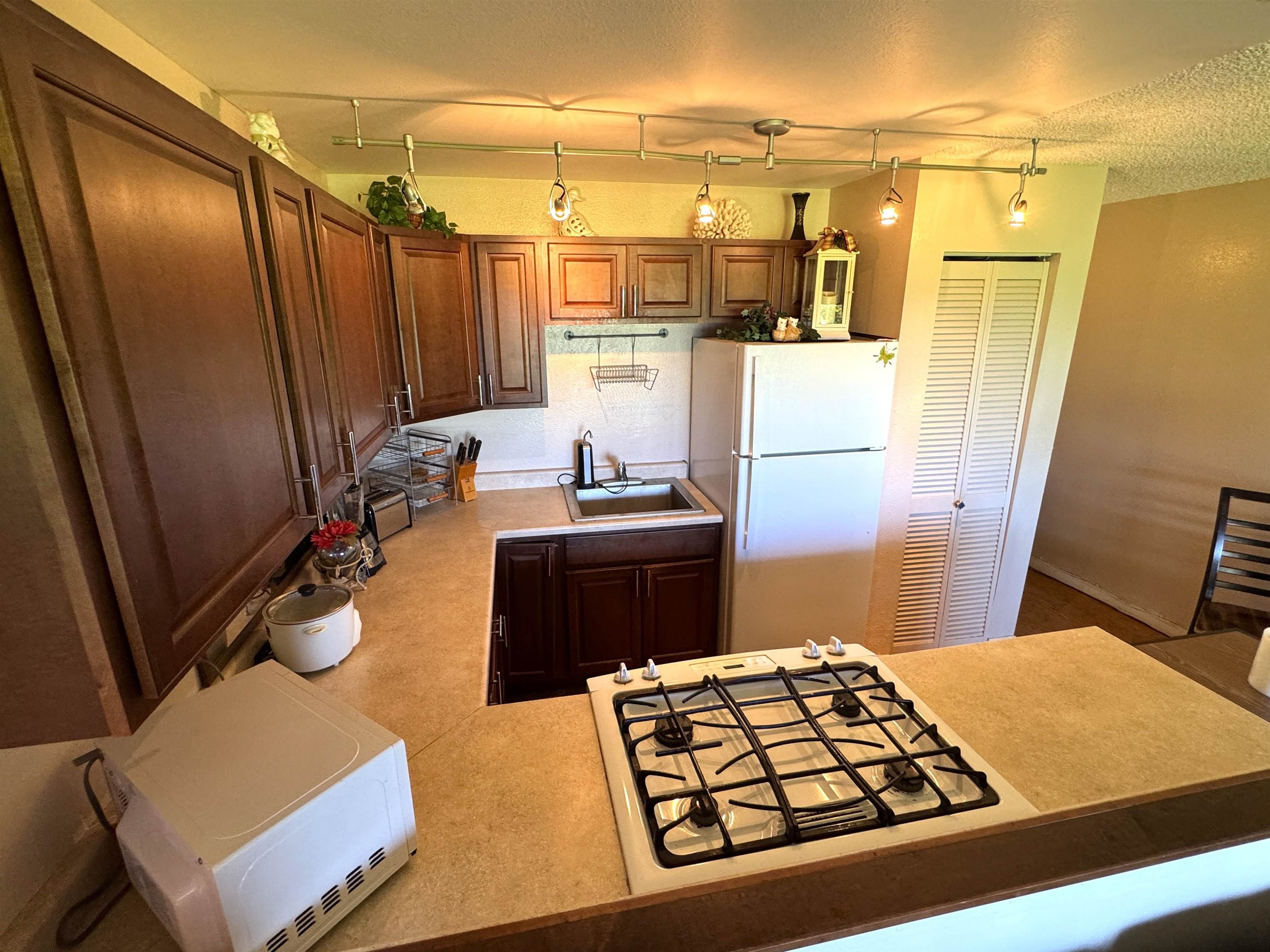Kamehameha V Highway, Unit 123B Kaunakakai, HI 96748 - Photo 13 of 25 a bathroom with a sink a toilet and shower