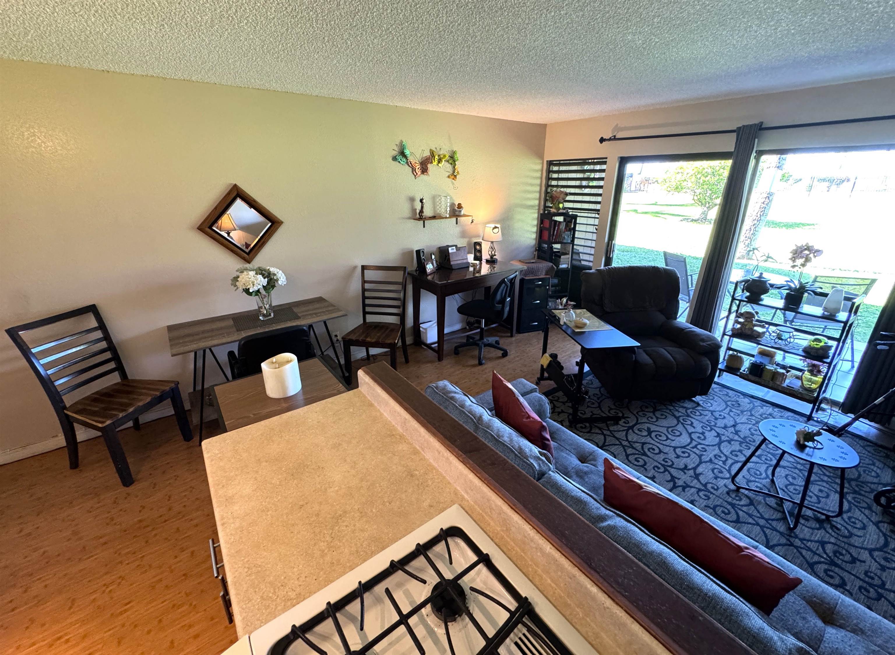 Kamehameha V Highway, Unit 123B Kaunakakai, HI 96748 - Photo 17 of 25 a living room with furniture rug and a window