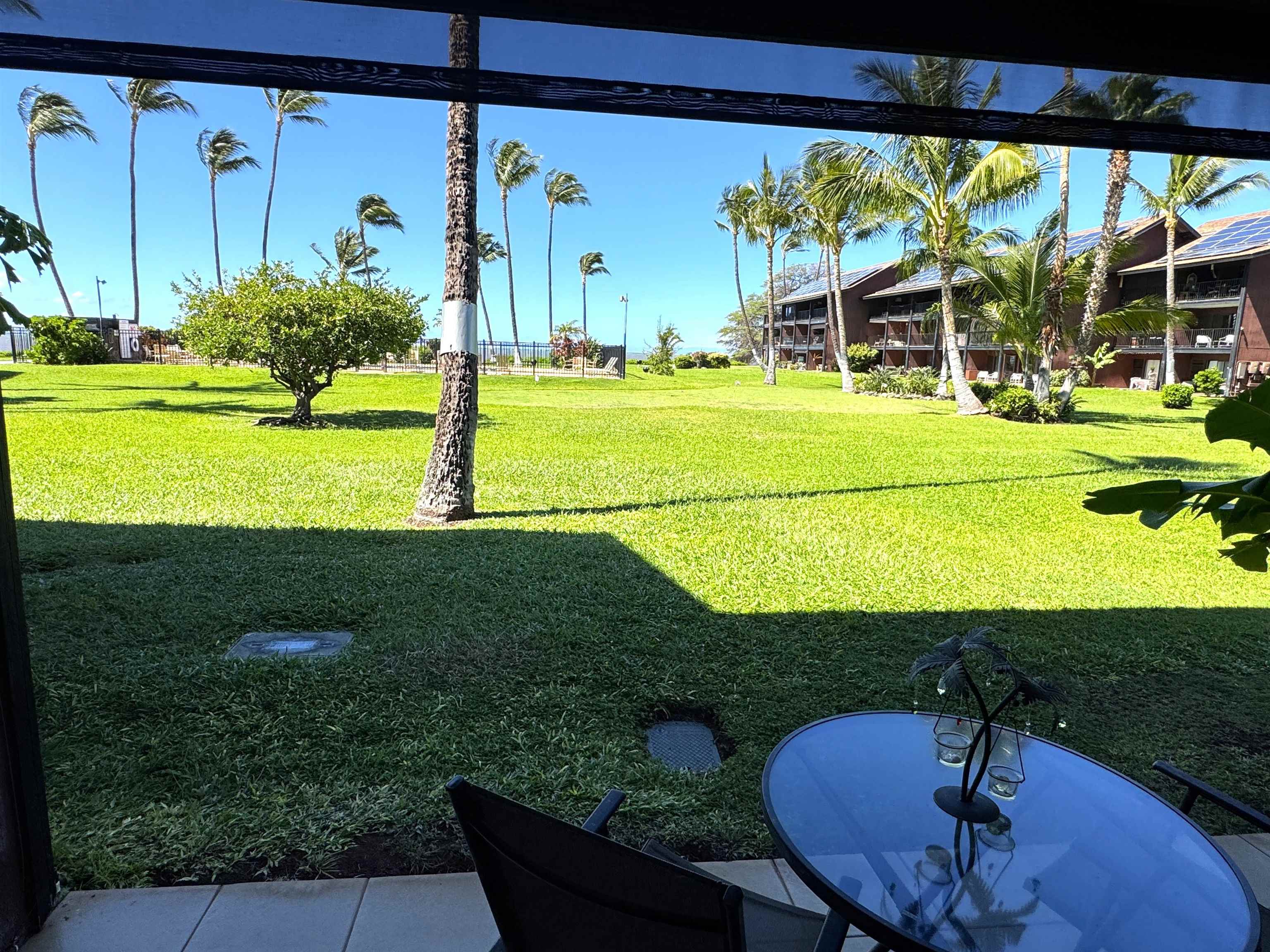 Kamehameha V Highway, Unit 123B Kaunakakai, HI 96748 - Photo 3 of 25 a view of a swimming pool with a yard