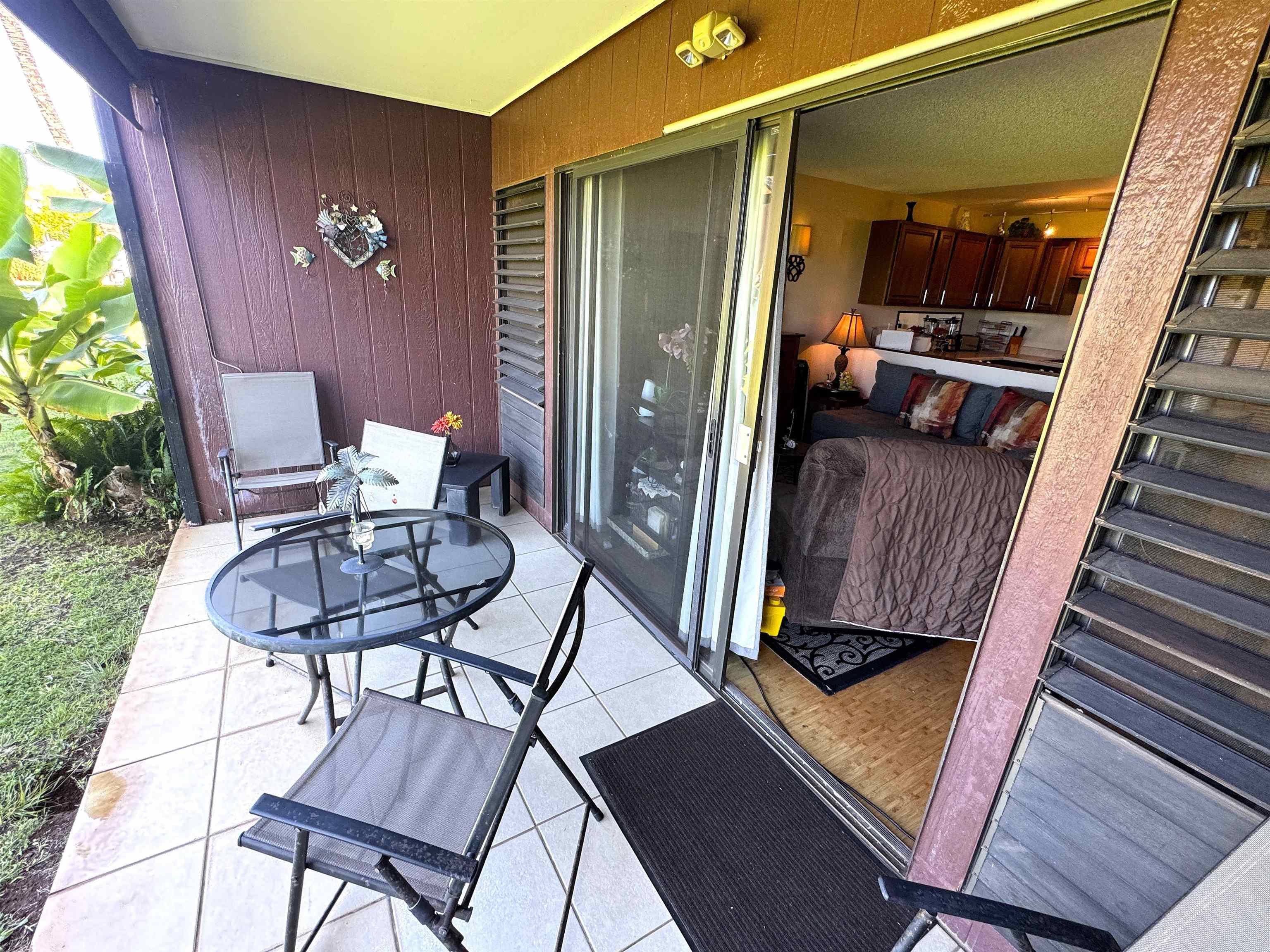 Kamehameha V Highway, Unit 123B Kaunakakai, HI 96748 - Photo 6 of 25 a view of balcony furniture and wooden floor