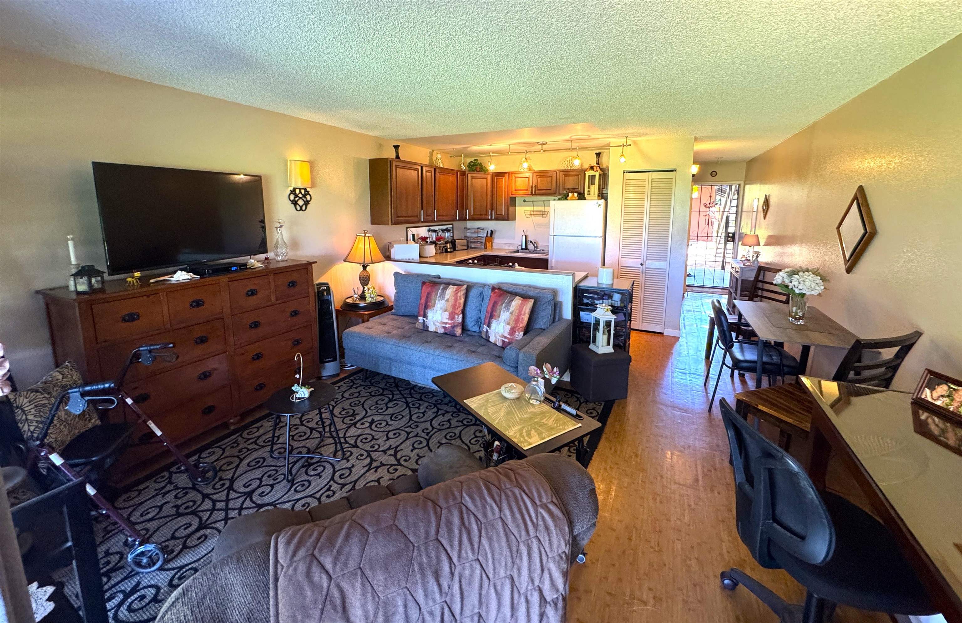 Kamehameha V Highway, Unit 123B Kaunakakai, HI 96748 - Photo 10 of 25 a living room with furniture and a flat screen tv