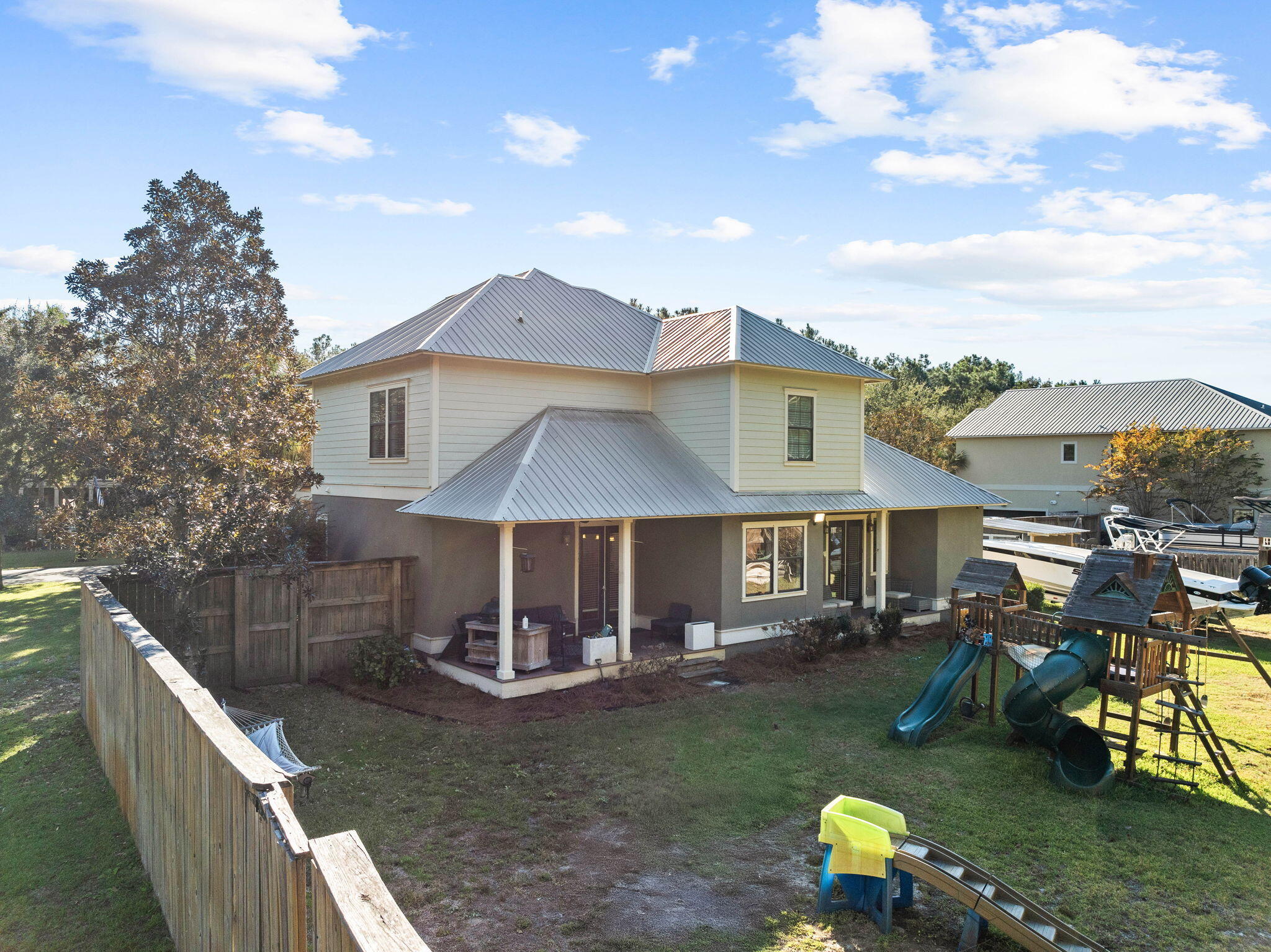 144 Preston Path Santa Rosa Beach, FL 32459 - Photo 15 of 60 a view of a house with backyard porch and sitting area