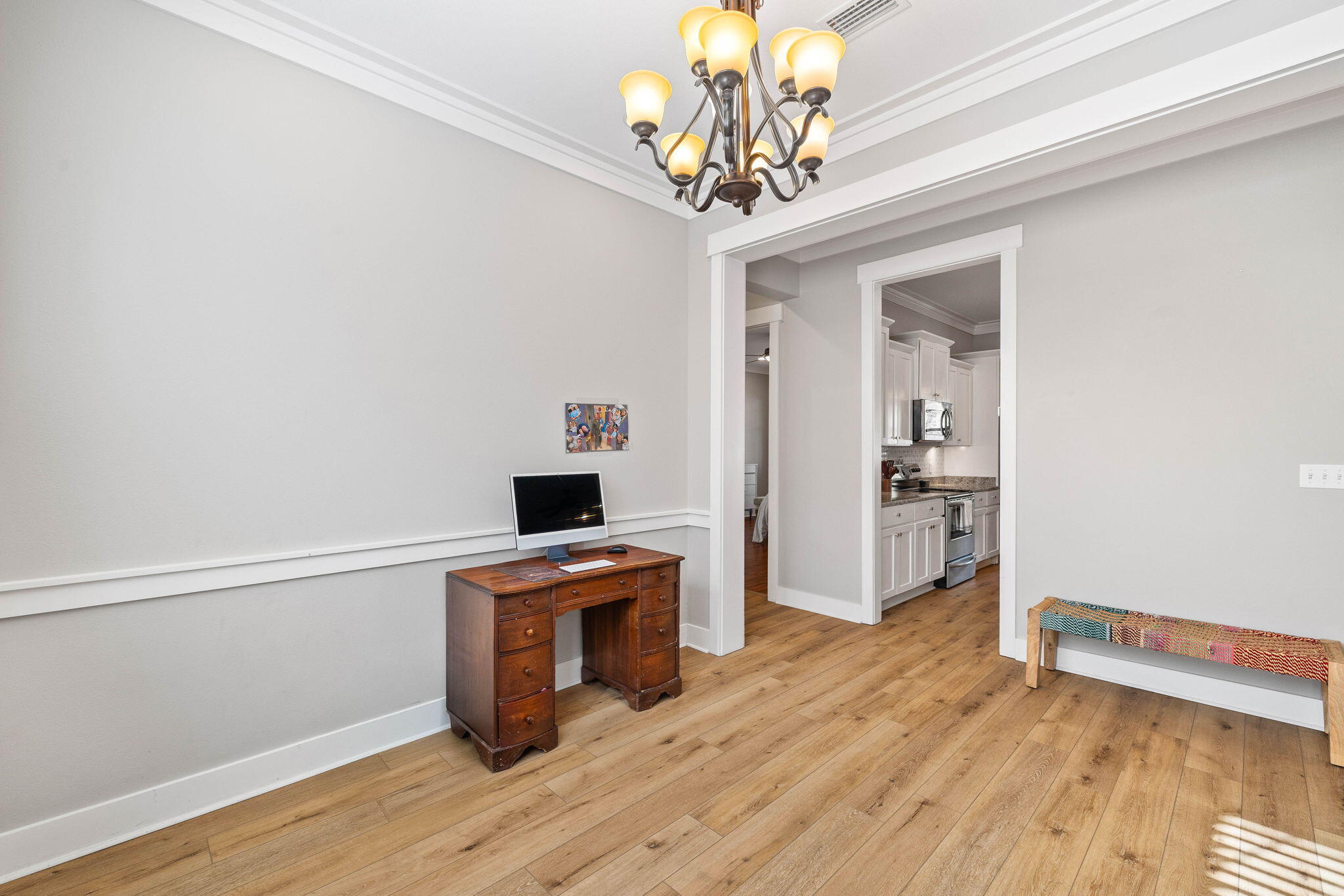 144 Preston Path Santa Rosa Beach, FL 32459 - Photo 25 of 60 a view of a room with wooden floor and chandelier