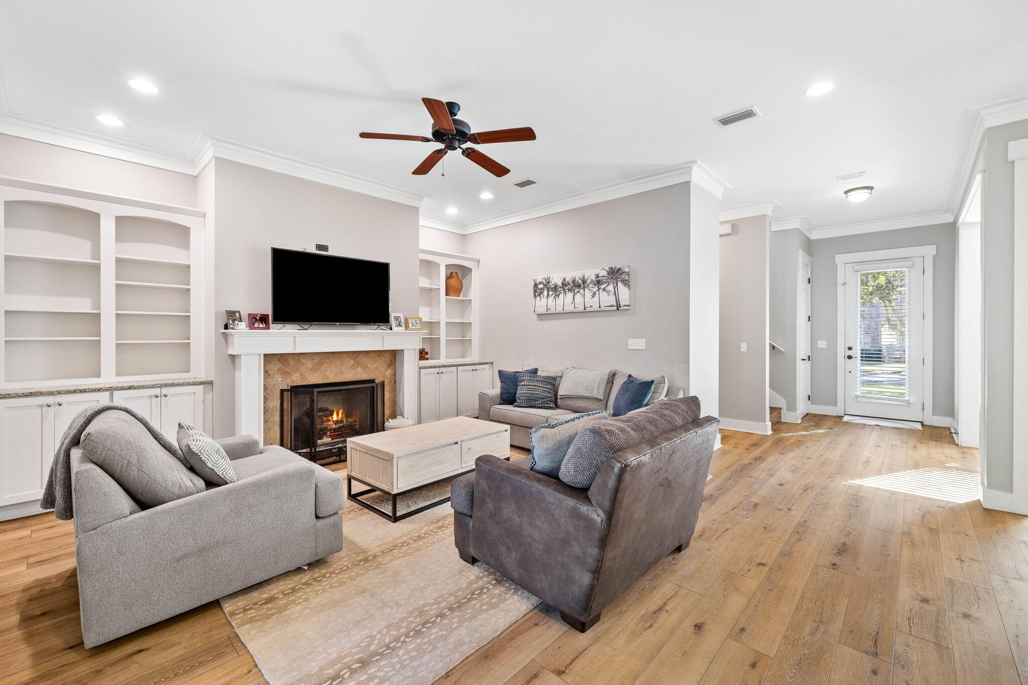 144 Preston Path Santa Rosa Beach, FL 32459 - Photo 29 of 60 a living room with furniture a flat screen tv and a fireplace