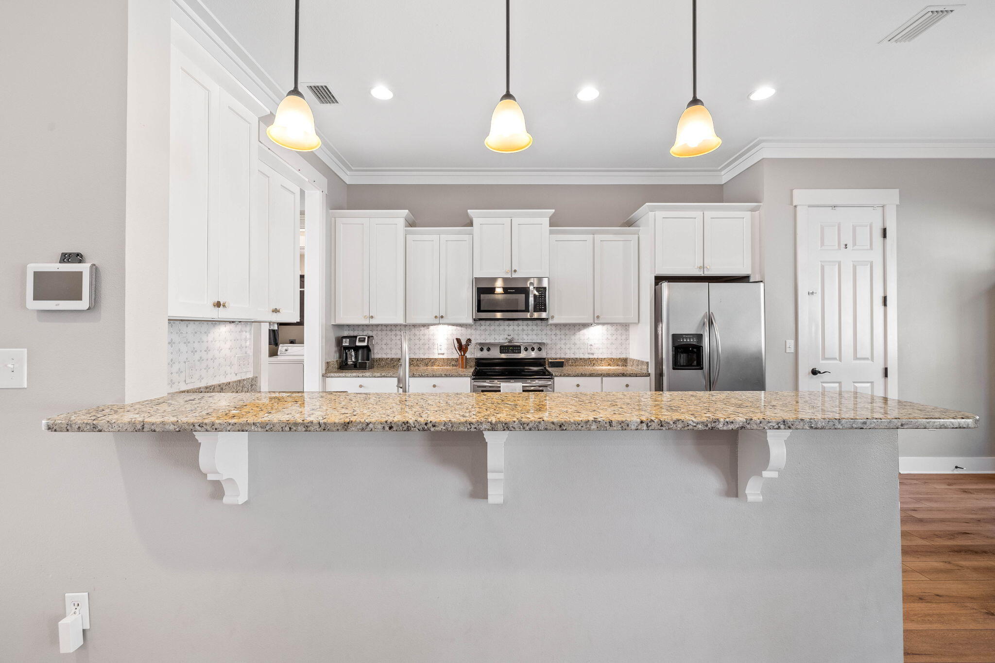 144 Preston Path Santa Rosa Beach, FL 32459 - Photo 31 of 60 a kitchen with stainless steel appliances granite countertop a sink a stove and refrigerator