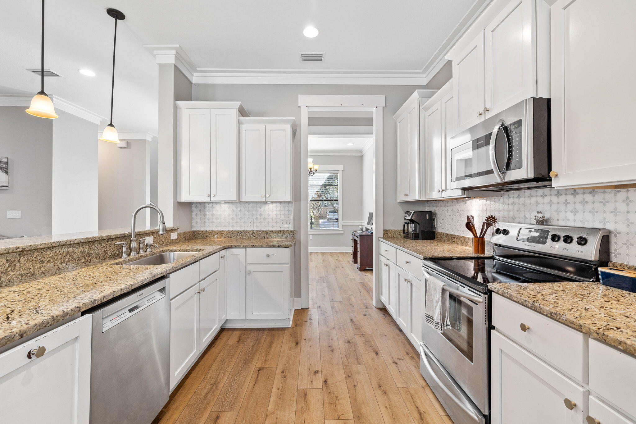144 Preston Path Santa Rosa Beach, FL 32459 - Photo 36 of 60 a kitchen with stainless steel appliances granite countertop a sink stove and cabinets