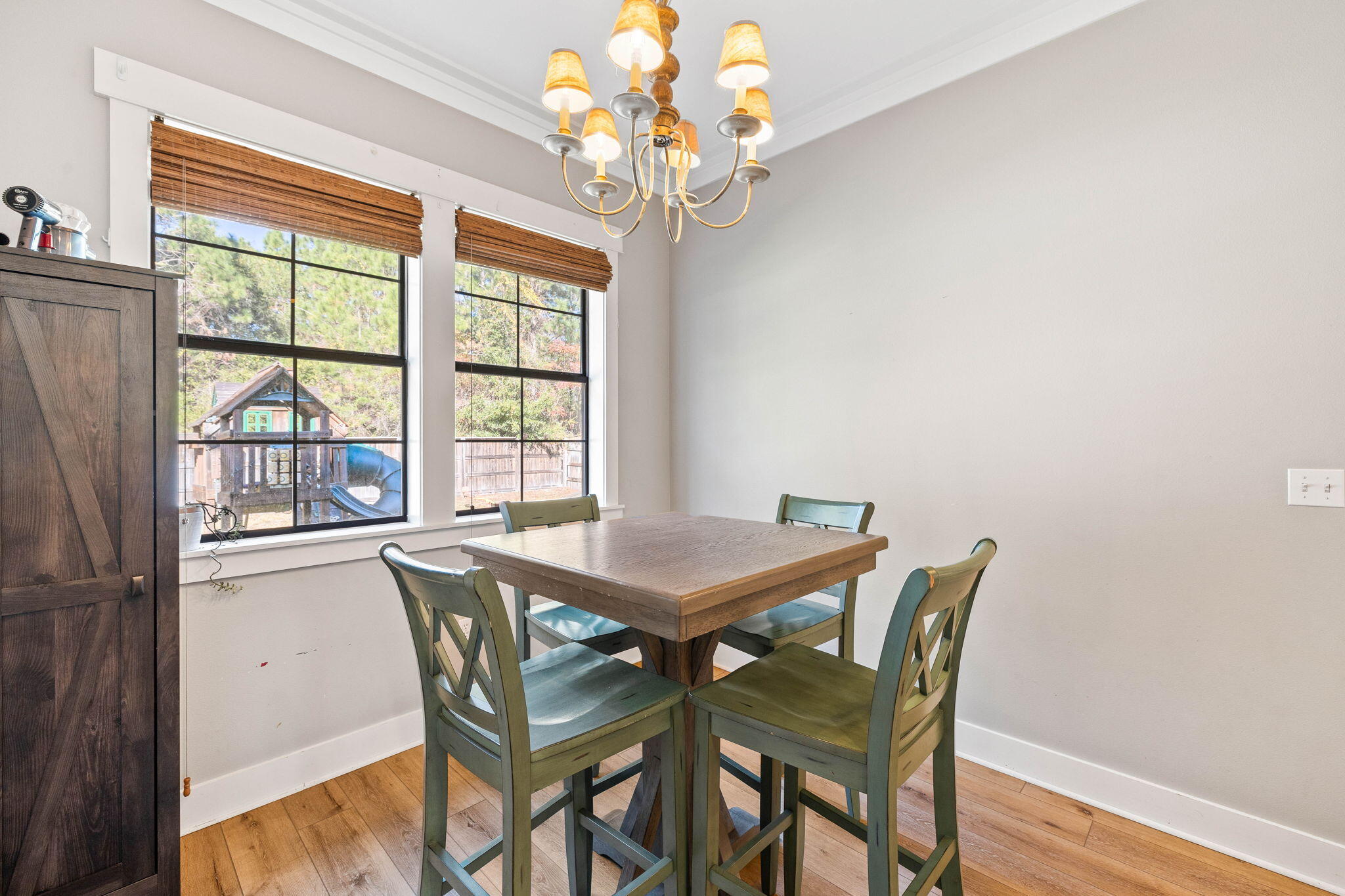144 Preston Path Santa Rosa Beach, FL 32459 - Photo 37 of 60 a view of a dining room with furniture a chandelier and wooden floor