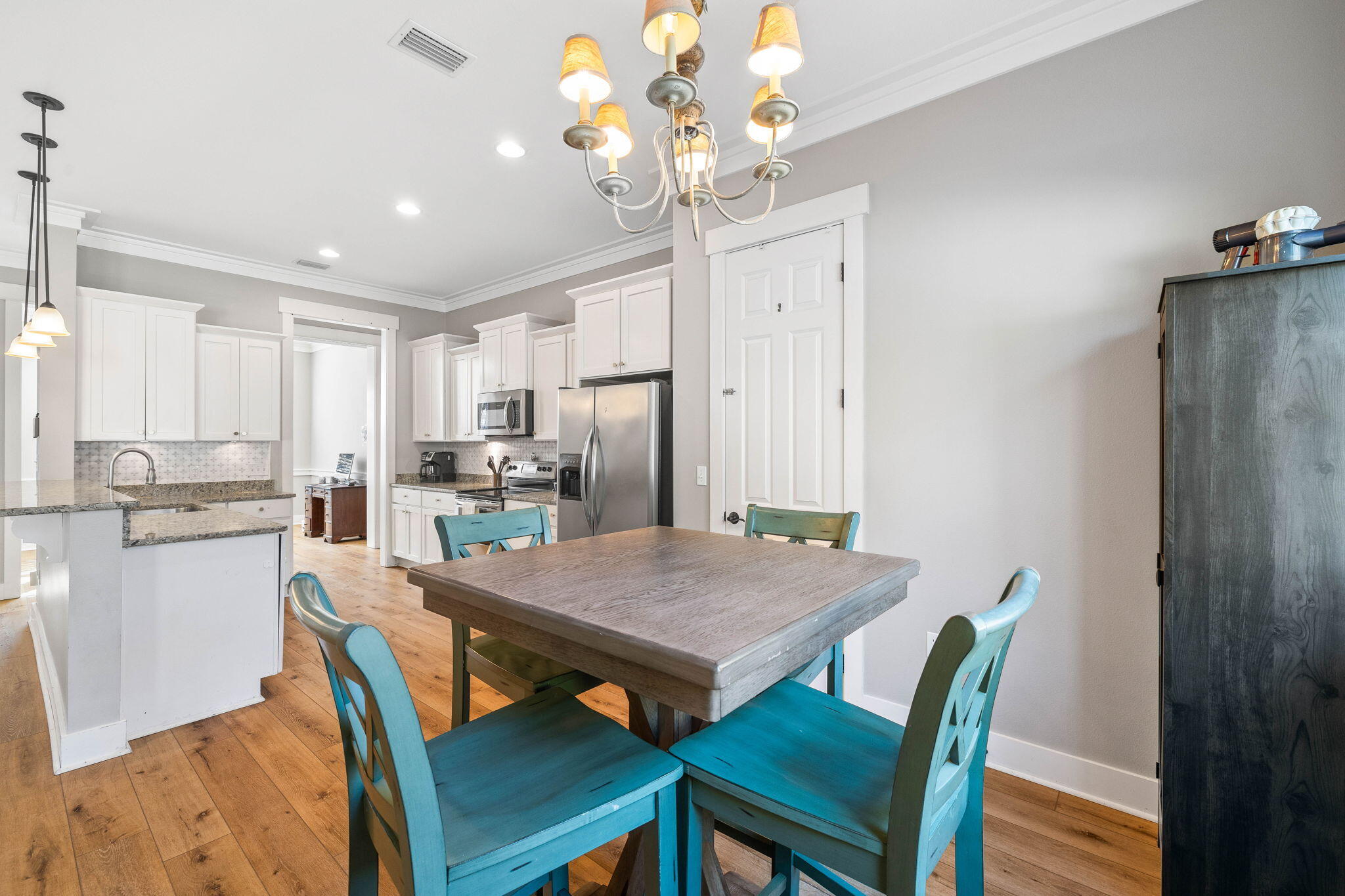 144 Preston Path Santa Rosa Beach, FL 32459 - Photo 38 of 60 a view of a dining room with furniture and wooden floor