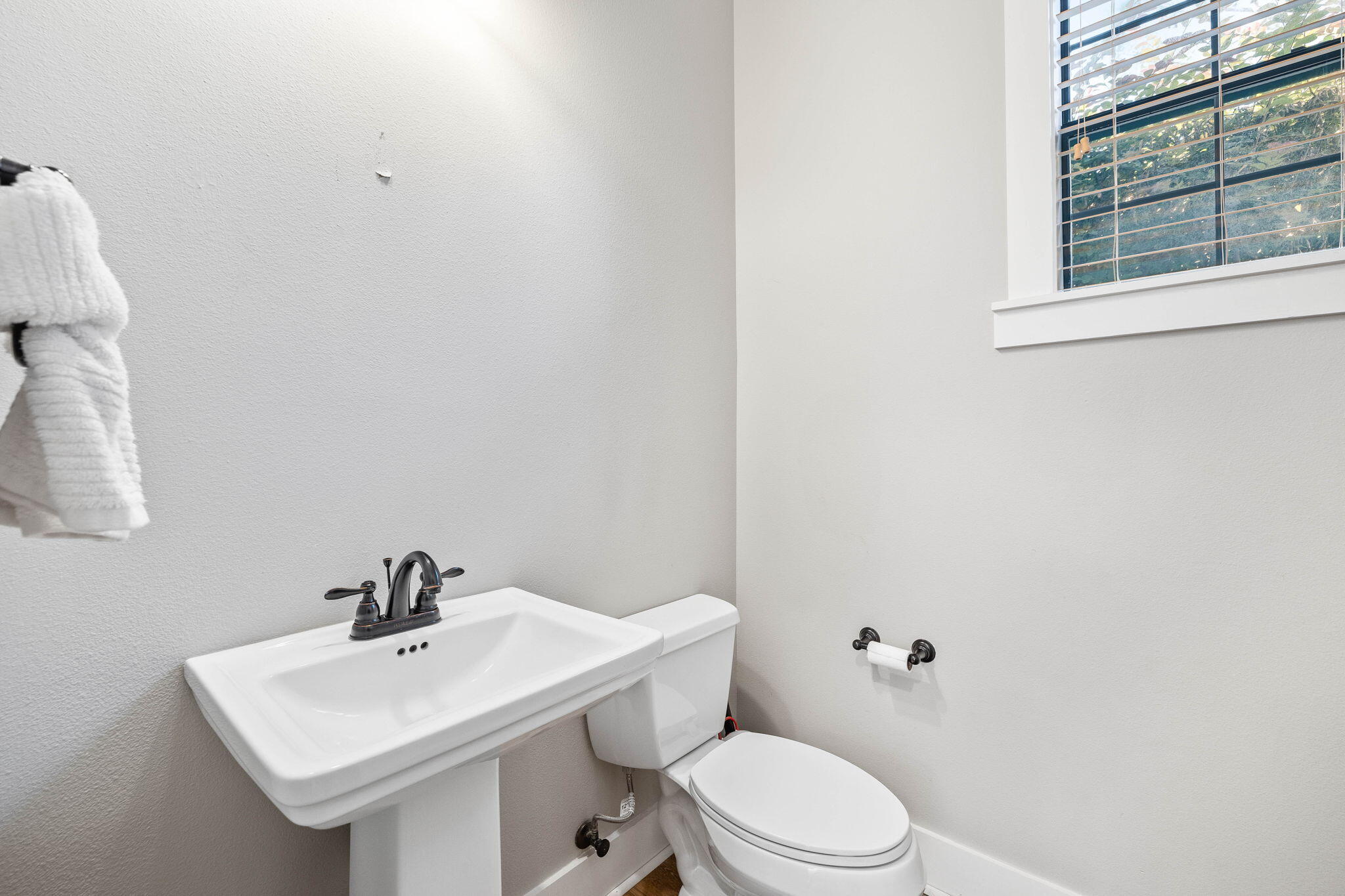 144 Preston Path Santa Rosa Beach, FL 32459 - Photo 40 of 60 a bathroom with a sink a toilet and mirror