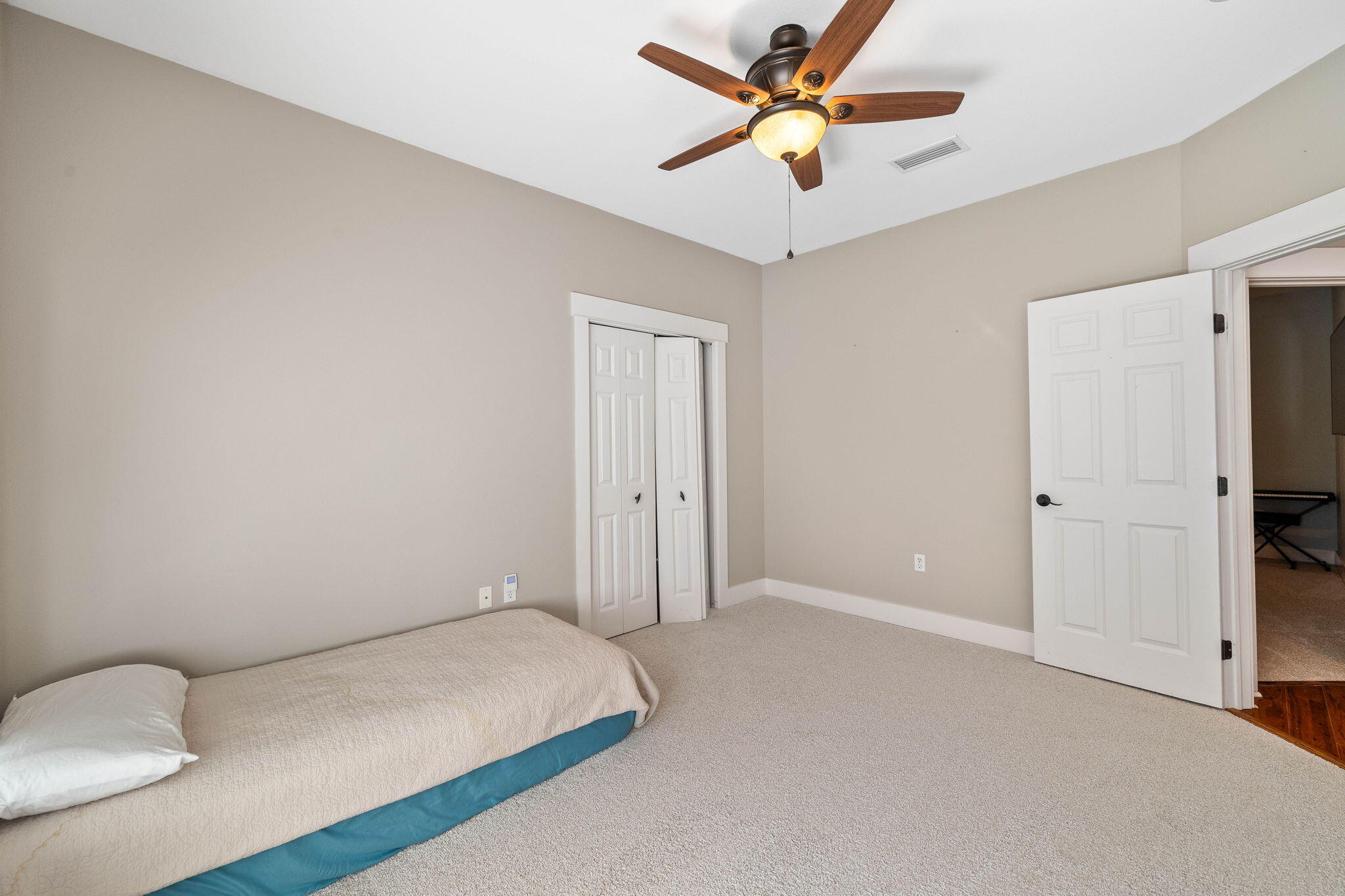 144 Preston Path Santa Rosa Beach, FL 32459 - Photo 52 of 60 a view of room with a ceiling fan