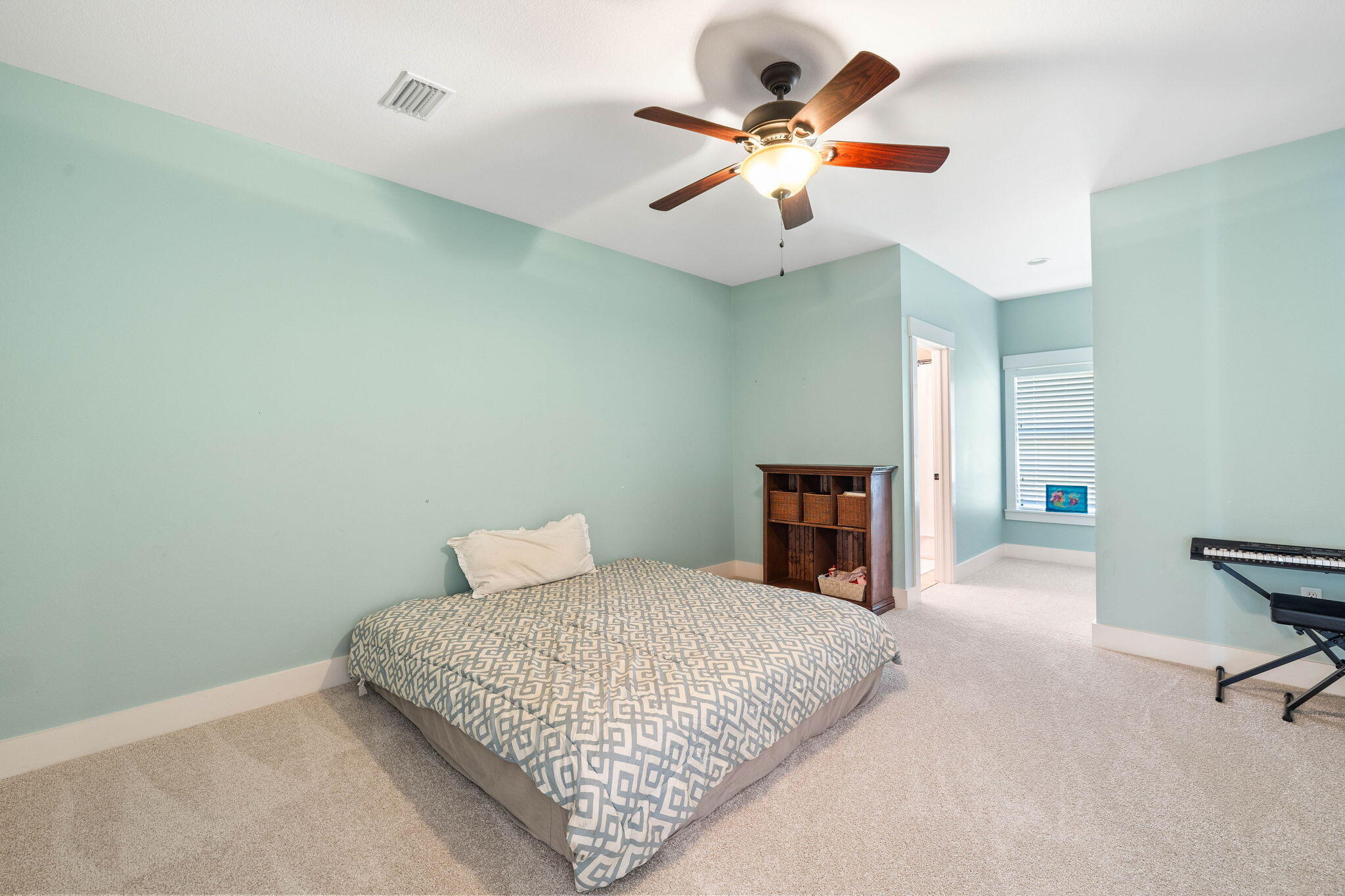 144 Preston Path Santa Rosa Beach, FL 32459 - Photo 53 of 60 a bedroom with a bed and a chandelier