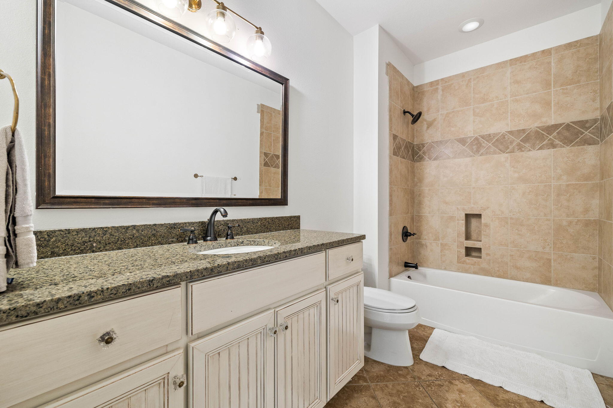 144 Preston Path Santa Rosa Beach, FL 32459 - Photo 57 of 60 a bathroom with a granite countertop sink a toilet and a bathtub