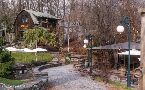 a view of a chairs and tables in patio