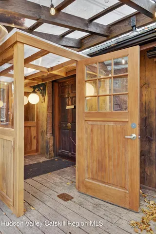a view of a porch with a wooden door