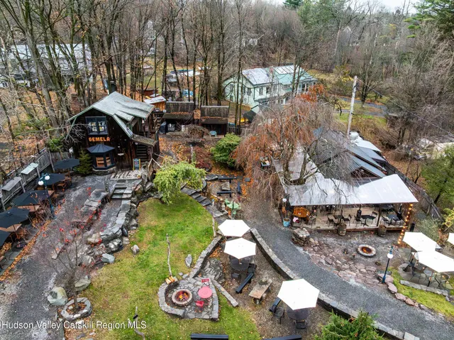 an aerial view of a house with garden space and street view