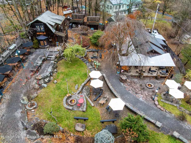 an aerial view of a multi story residential apartment building with outdoor space