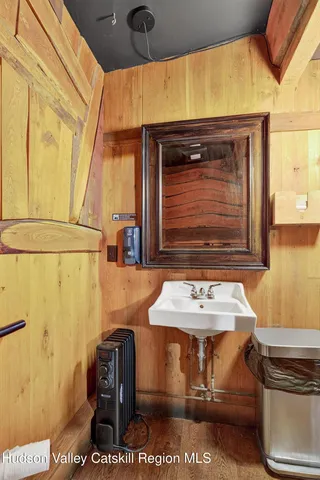 a bathroom with a toilet a sink and a window