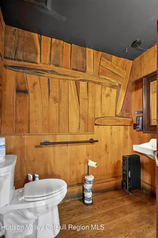 a view of a porch with a wooden floor and windows