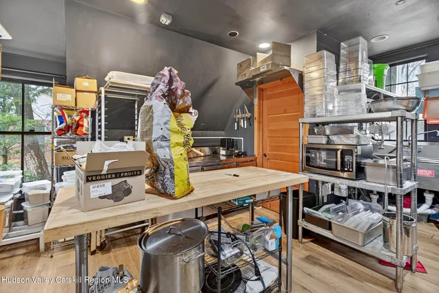 a kitchen with stainless steel appliances kitchen island granite countertop a sink and cabinets