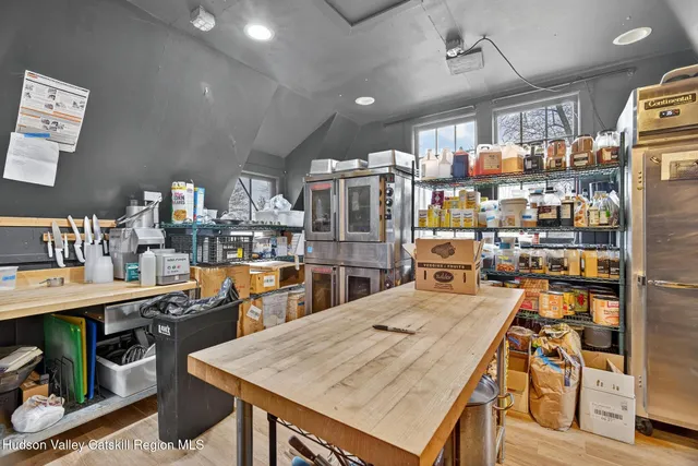 a bathroom with a toilet a sink and a window