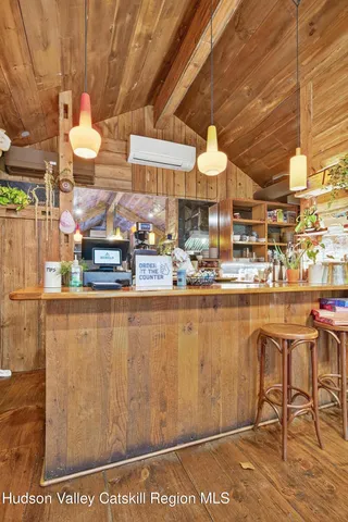a dining room with a table and chairs