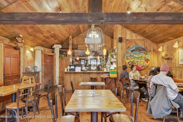 a view of a swimming pool with outdoor seating